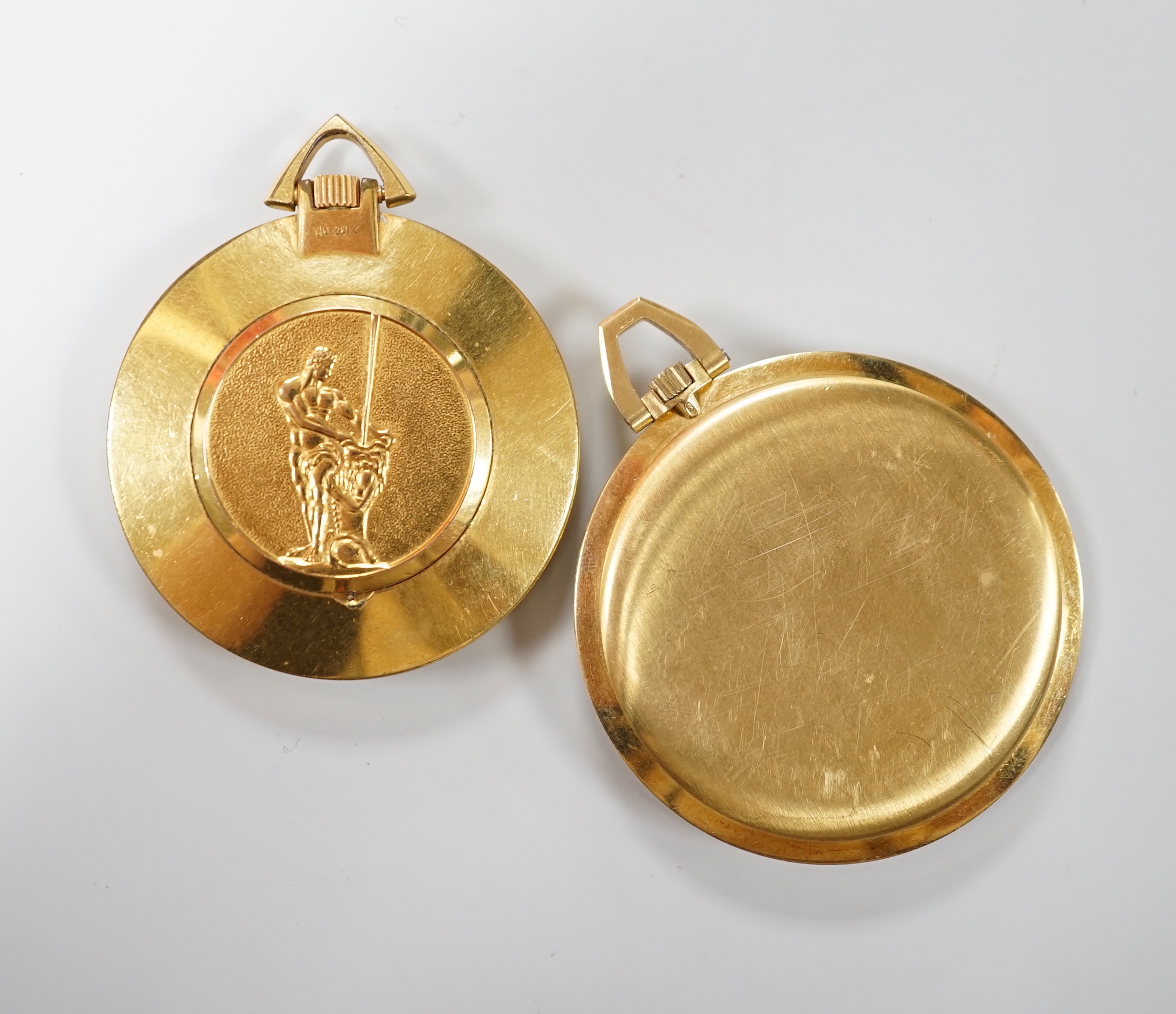 A 750 yellow metal Omega open faced keyless dress pocket watch, case diameter 42mm, gross weight 43.1 grams and a Rukela dress pocket watch.